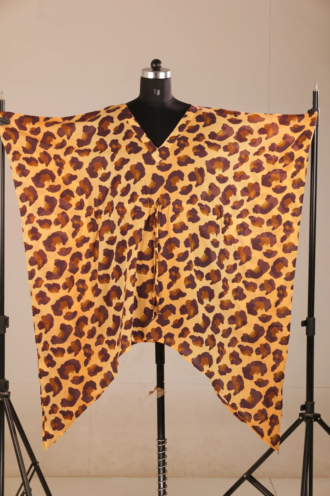 Before: leopard-print kaftan on a mannequin