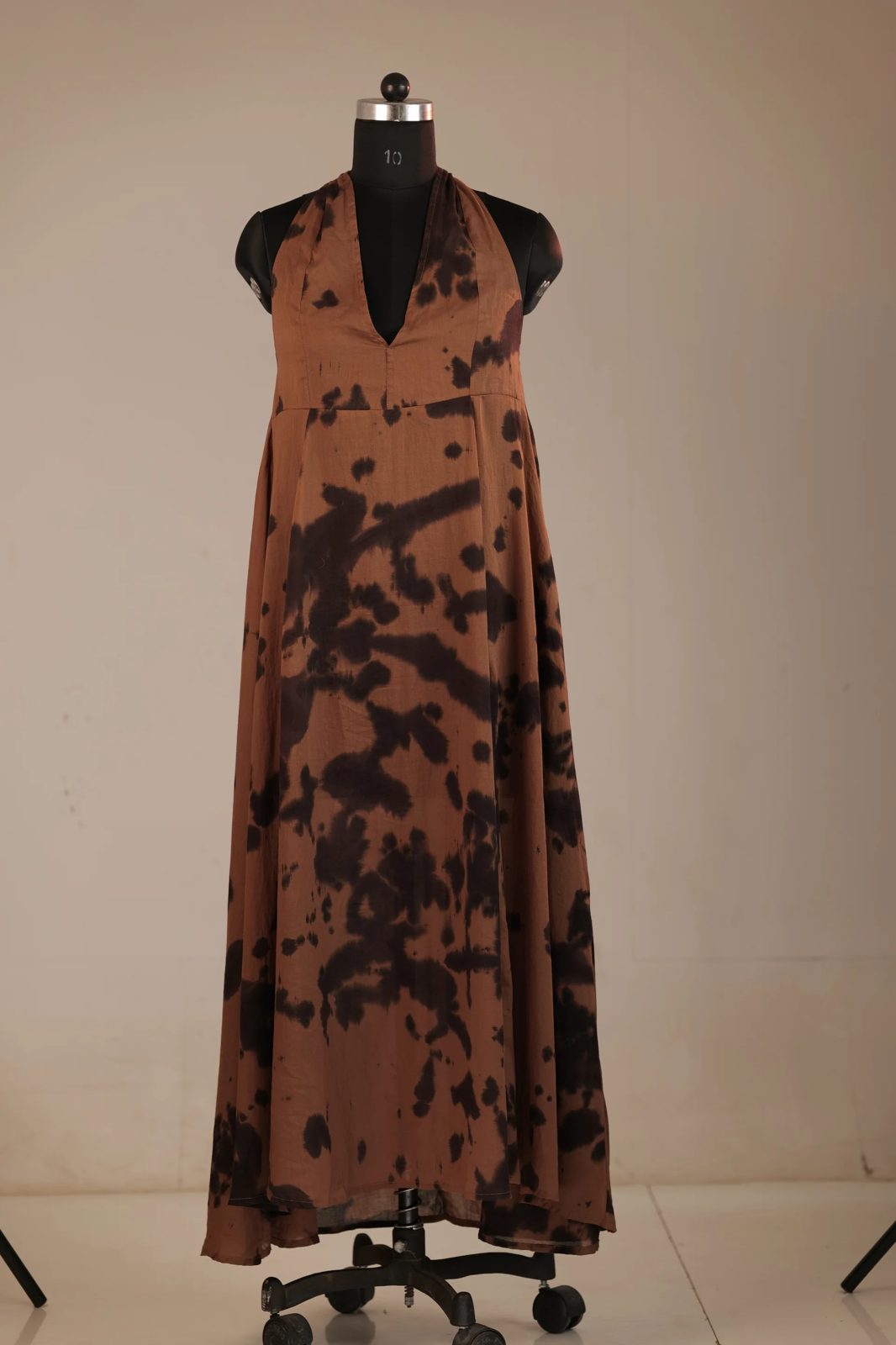 Before: brown tie-dye halter dress on a mannequin